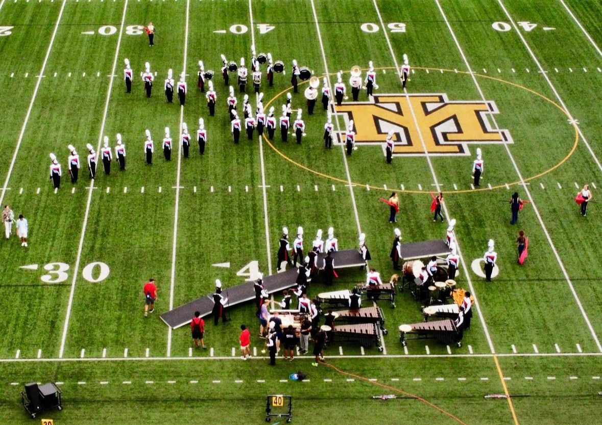 Viper Vanguard marching band in formation on football field